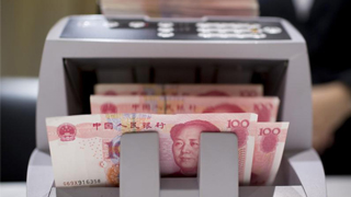 人民币逆势反弹 在岸夜盘收复6.89