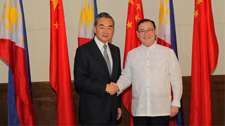 王毅：承担共同责任，维护南海和平稳定