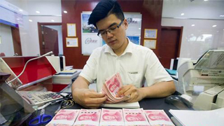 中国去年人民币贷款增16.17万亿元 房地产贷款增速回落