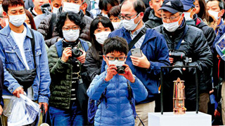 东京奥组委高官：圣火传递按计划实施