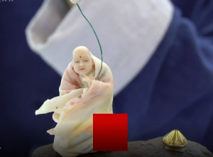 面塑传人挑战肉眼极限 5毛钱硬币上雕出“十八罗汉”